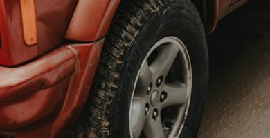 a red truck parked on the side of the road