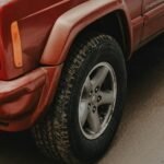 a red truck parked on the side of the road