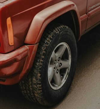 a red truck parked on the side of the road